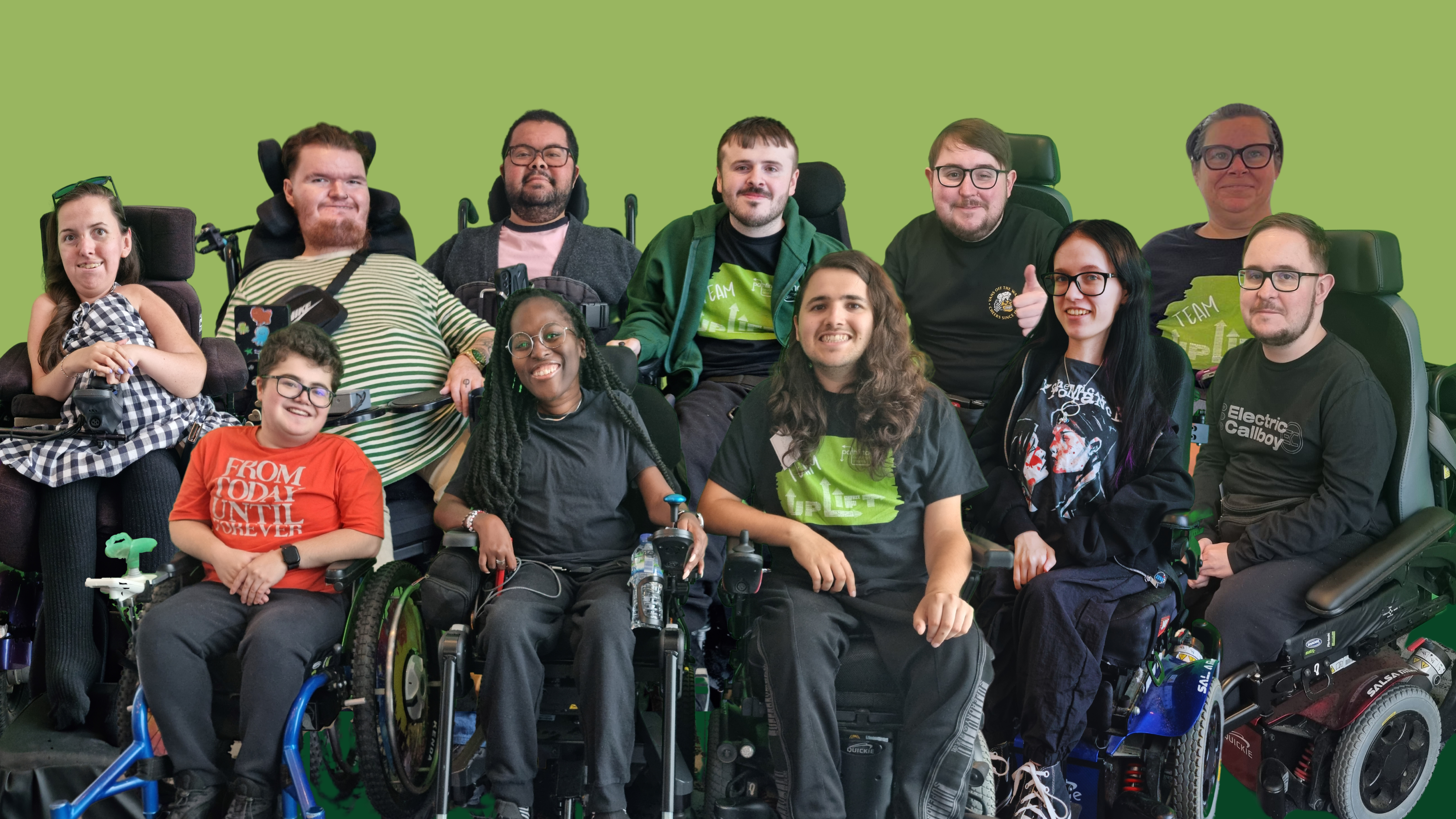 A group of three wheelchair users sit facing the camera, smiling. On the left is a white man with glasses and dark hair, wearing a ventilator and a black, rap-themed T-shirt. In the middle is a white woman with brown hair and glasses, wearing a blue T-shirt and green cardigan. On the right is a white-haired woman with glasses, wearing a flowing white shirt. This is for an article on advice and resources.