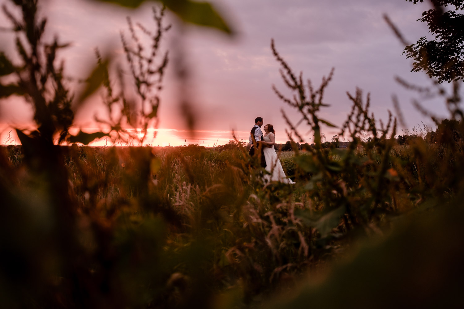 bride and groom enjoy a sunset at west tower
