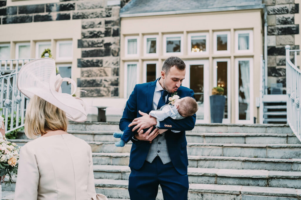 groom and baby