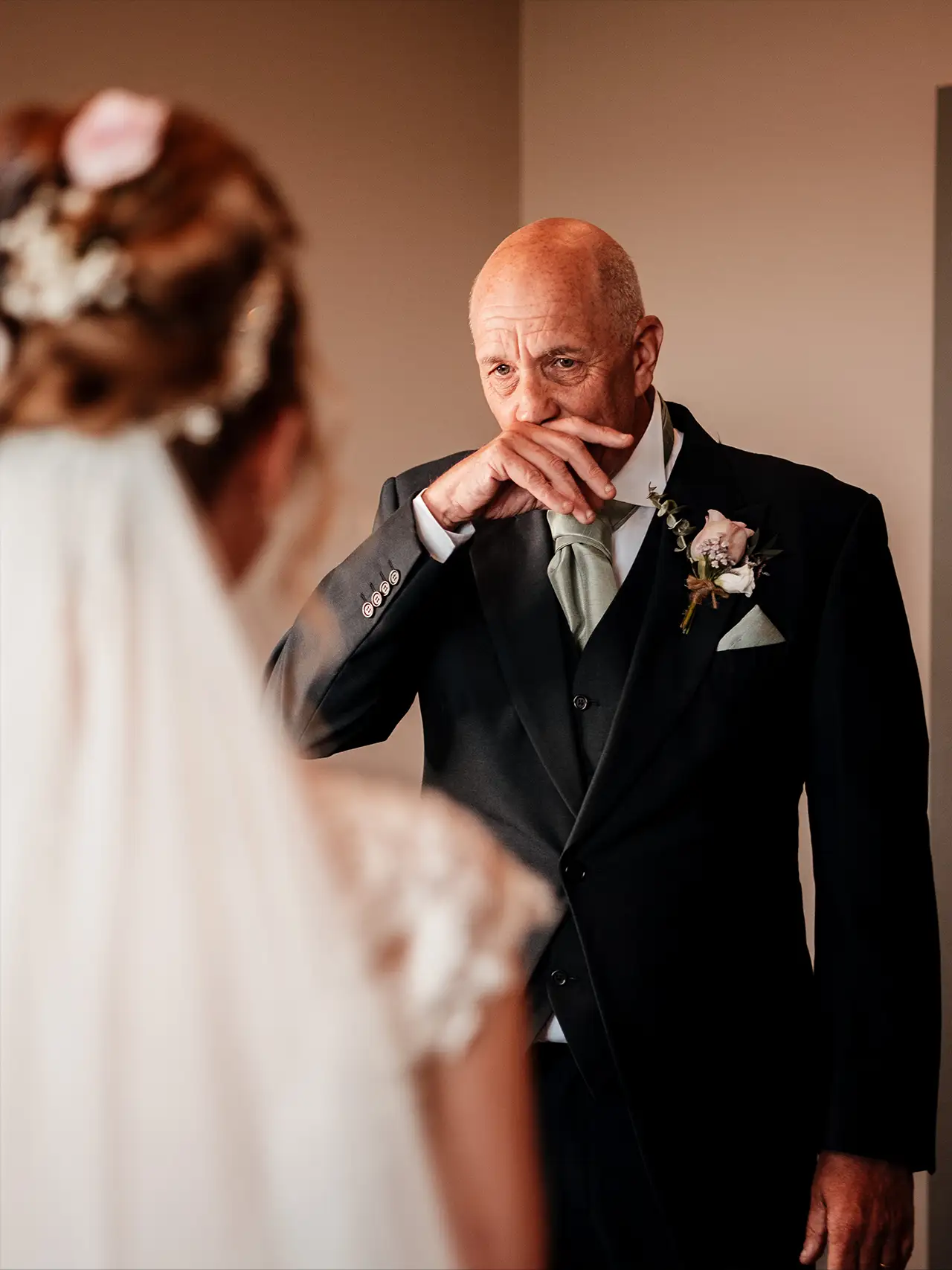 father seeing his daughter in her wedding dress for the first time