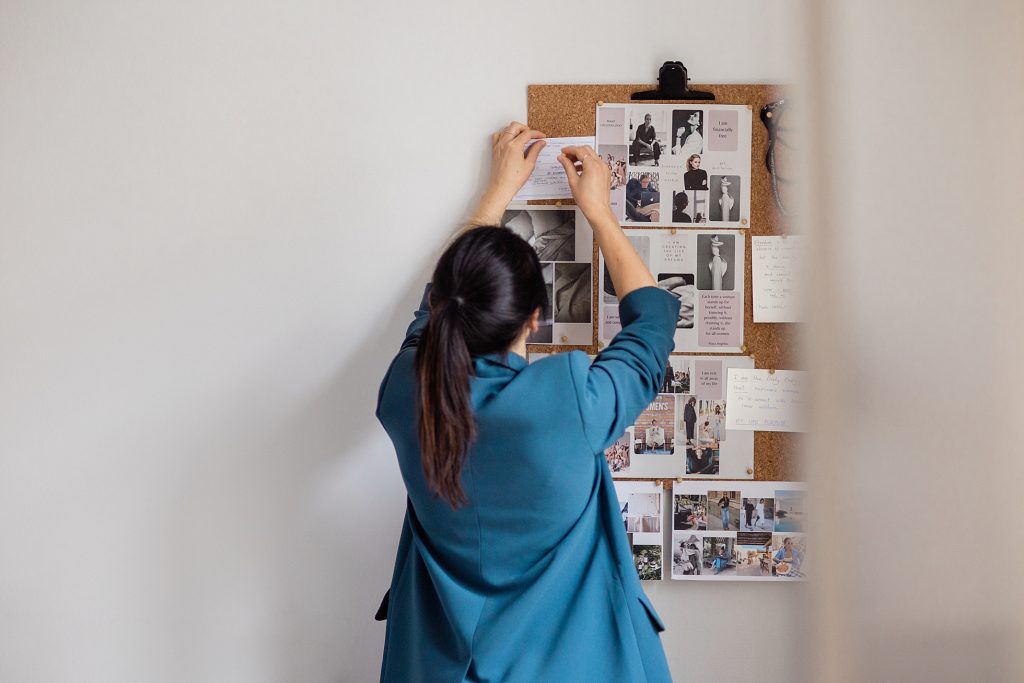 A personal brand photo of a life coach creating a vision board