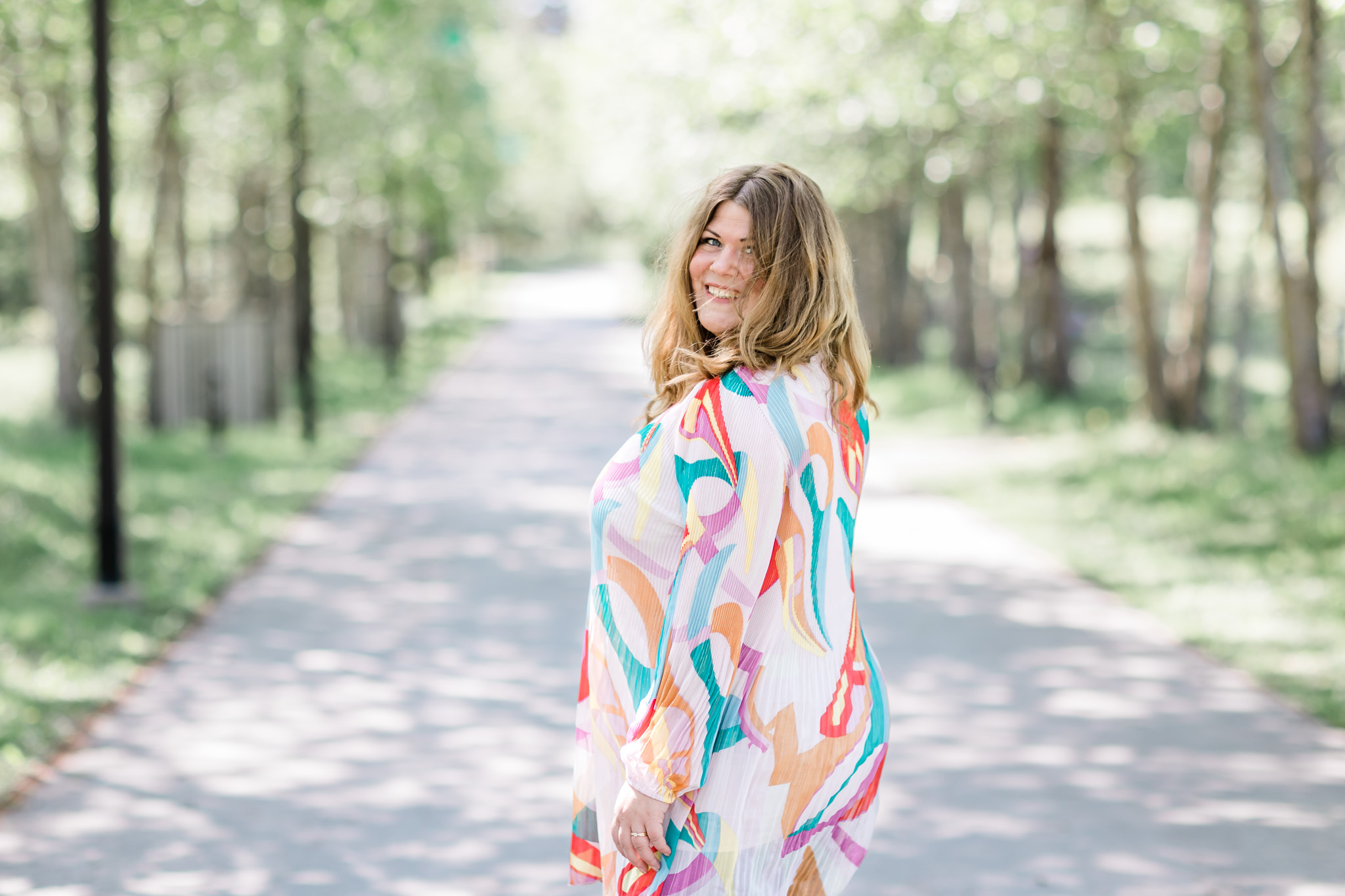 a joy-filled photo of coach and author Jessica Jäger as she looks back at the camera and smiles