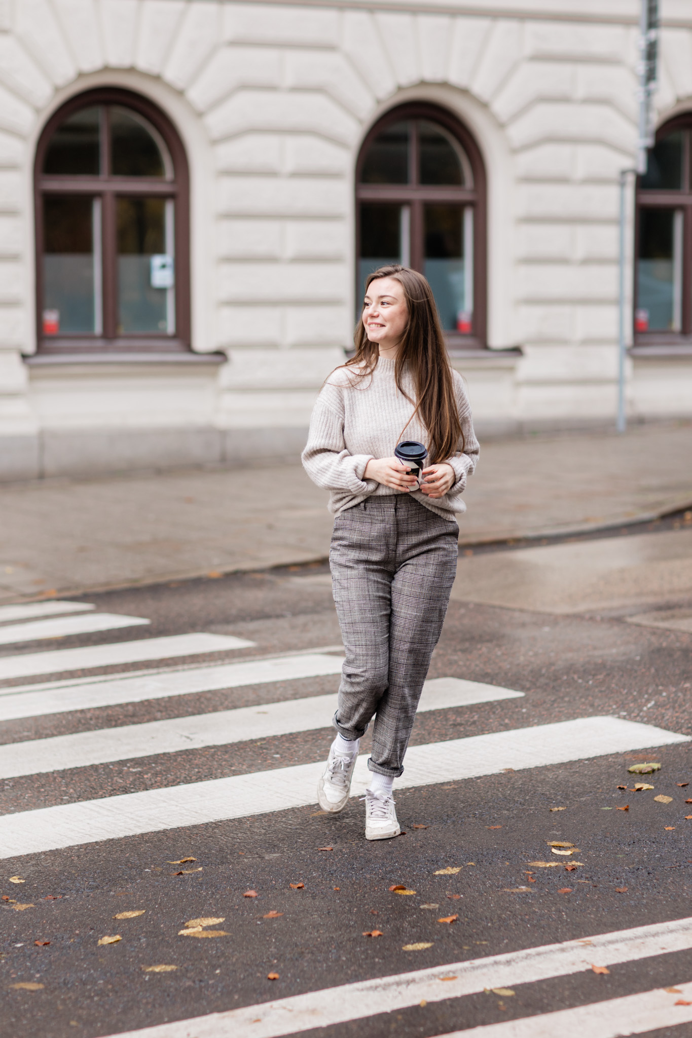 a personal brand photo of Anna Monika crossing a street in Stockholm
