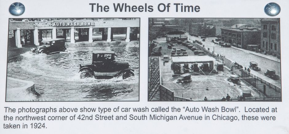 A placard displayed next to the 1927 Ford Model T Tudor parked in front of Class Act Auto Wash shows the 