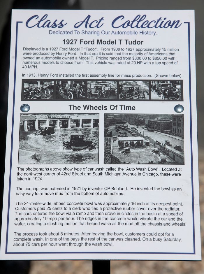 A placard displayed next to the 1927 Ford Model T Tudor parked in front of Class Act Auto Wash shows the 