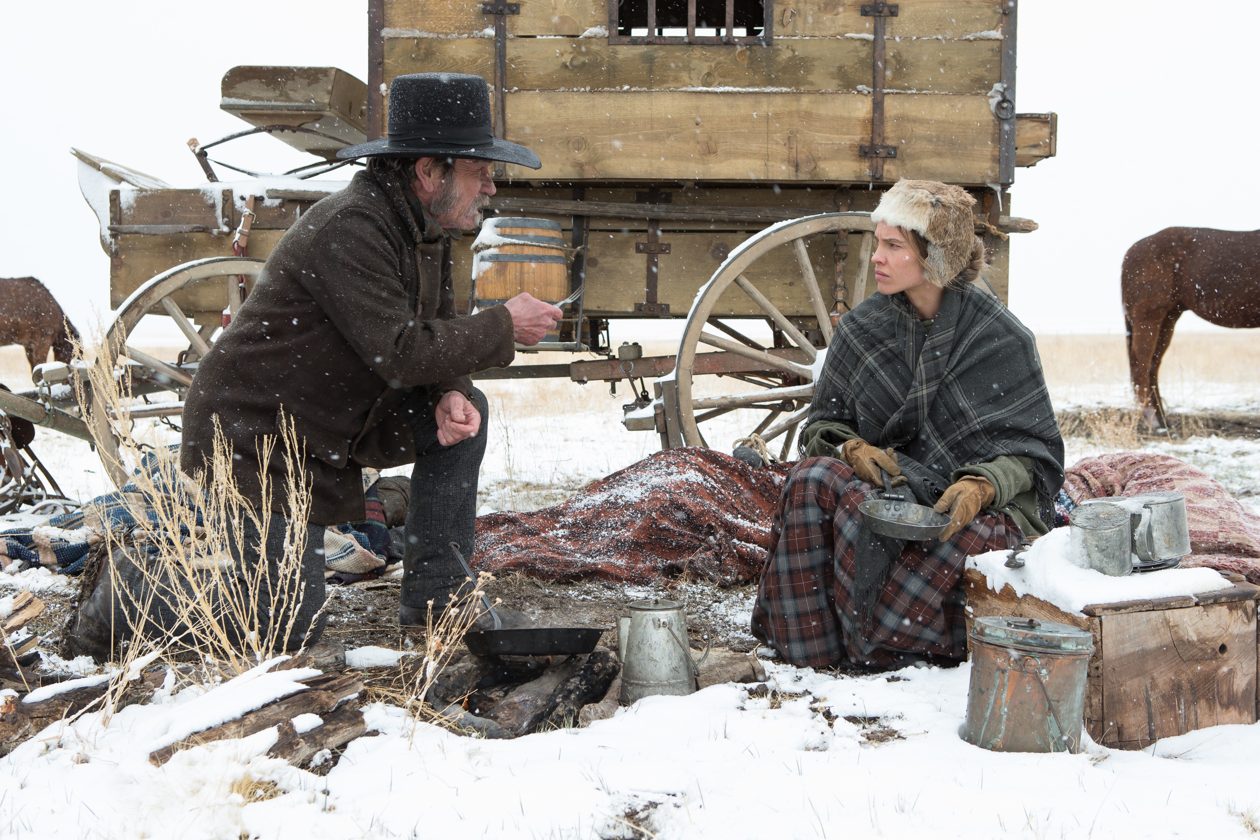man and woman and wagon in the Homesman