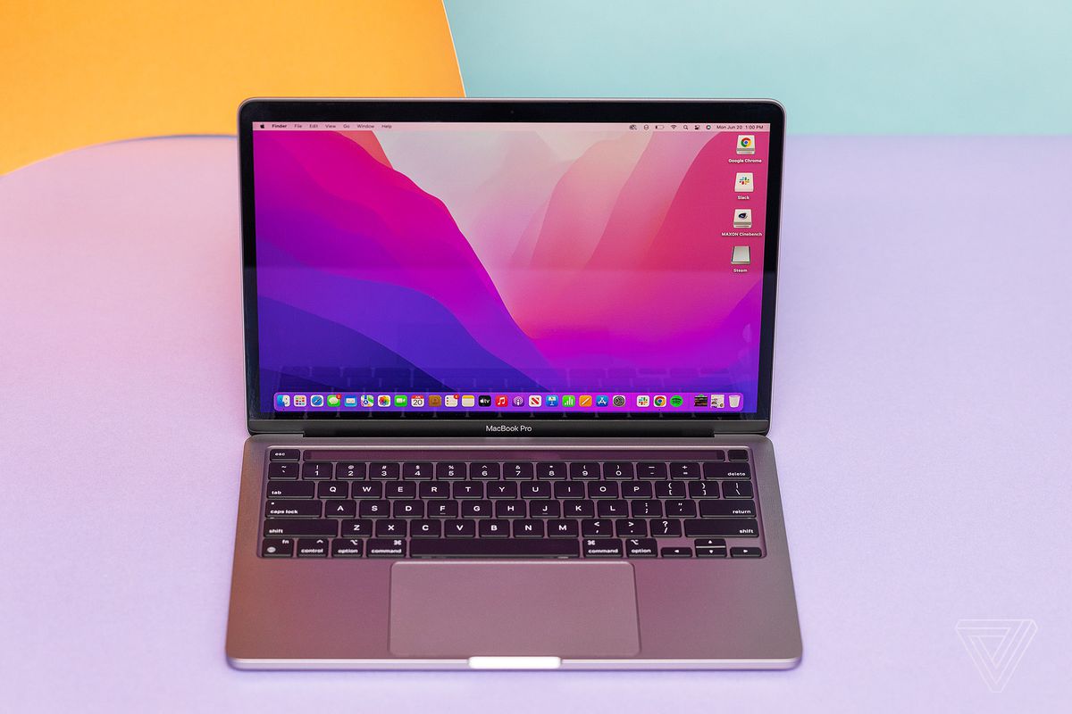 The Apple MacBook Pro 13 2022 seen from above on a lavender background.
