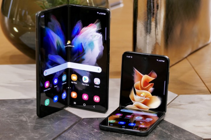 The Samsung Galaxy Z Fold 3 and the Flip 3 together, showing their partially folded displays.