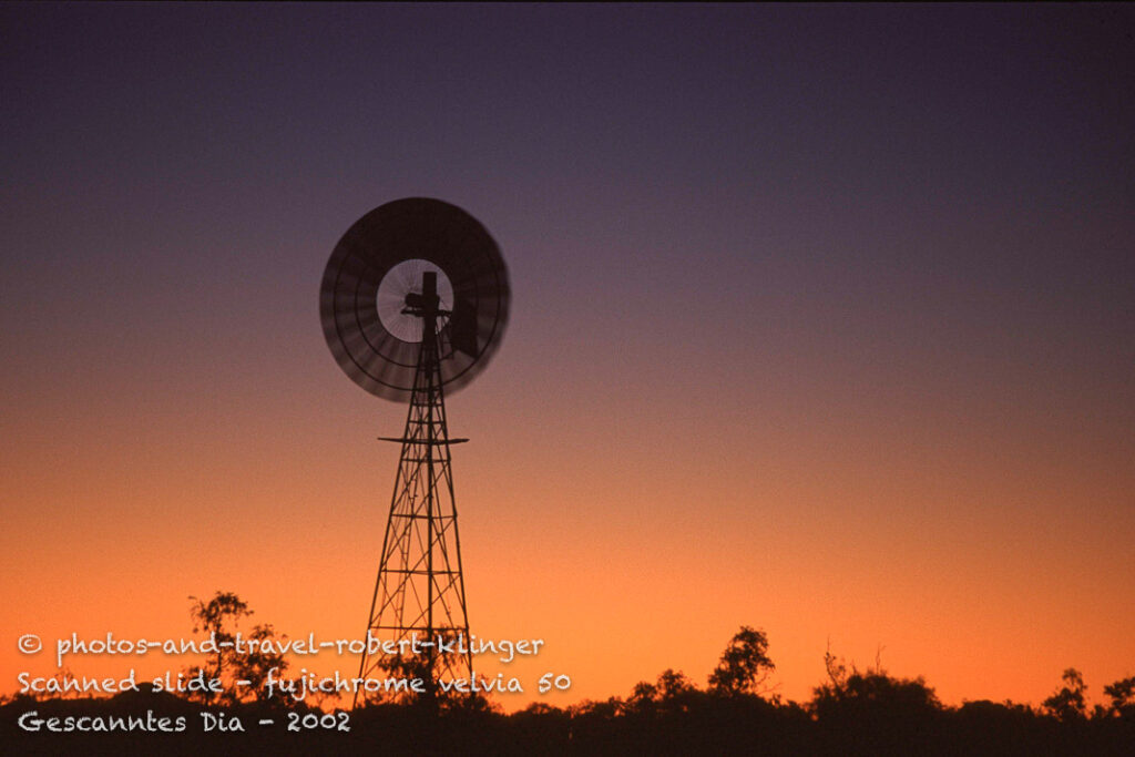 A well in Australia, water is pumped up by a wind-mill