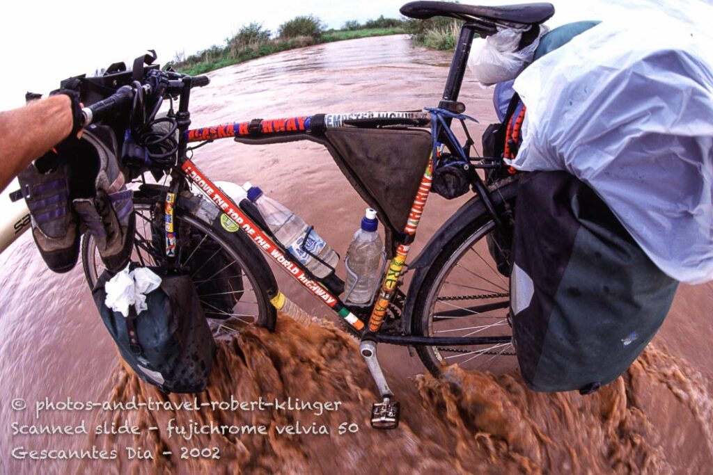 Crossing a flood by bicycle in the NT, Australia