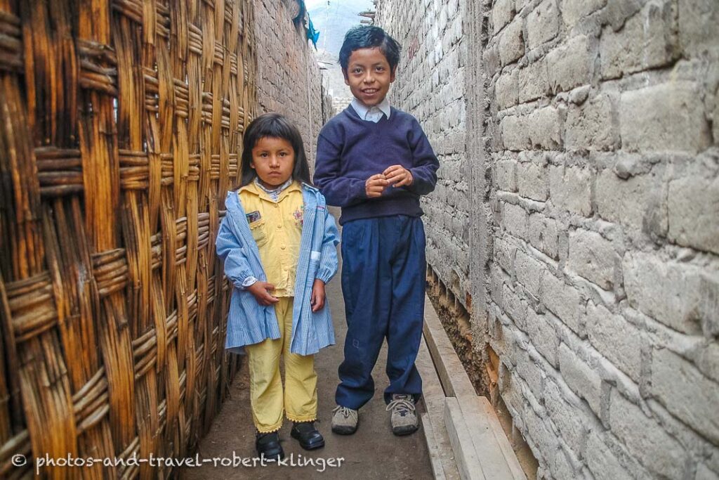 a little girl and her big brother in Lima, Peru