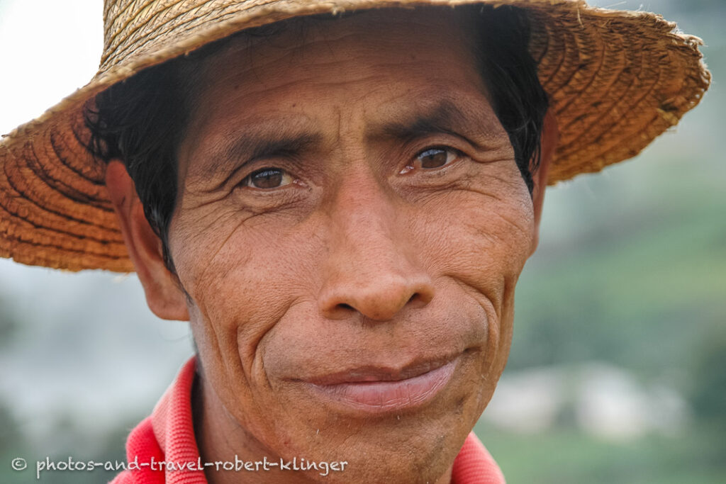 Face of a man in Honduras with a straw hat