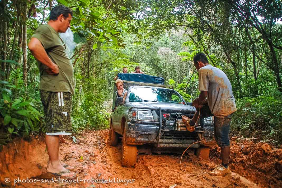 Backpacker are being transported by 4x4 drive throught the jungle of Panama