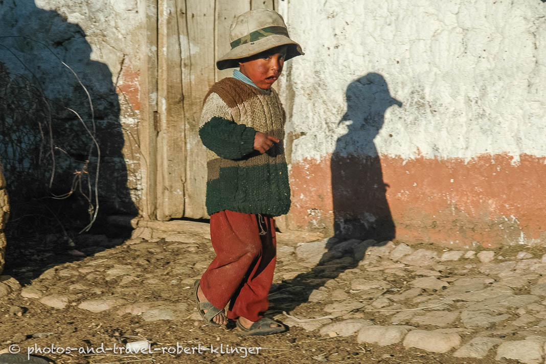 A boy in the andes on a early morning in Peru