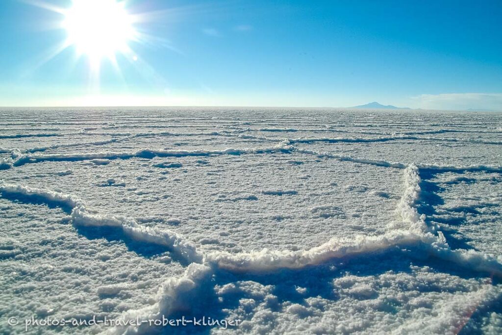 salar de uyuni in Bolivia and the sun