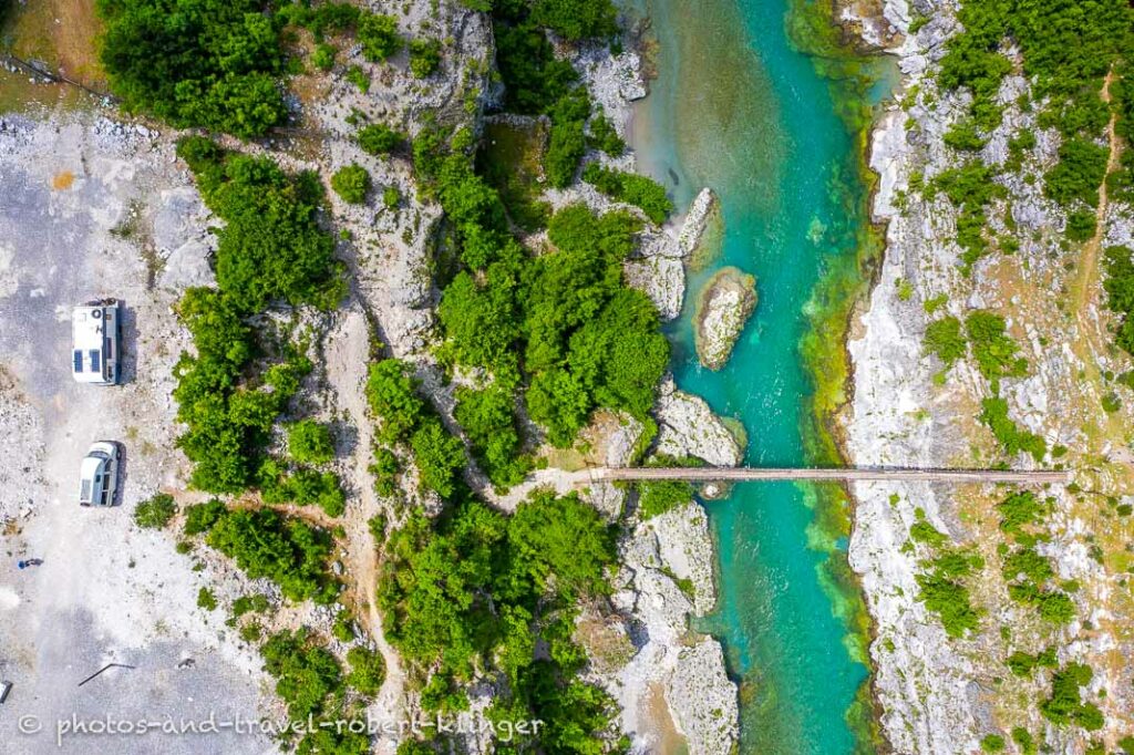 Vanlife - camping by a river in Albania, drone shot