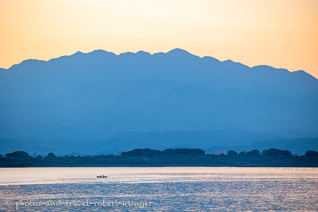 A fishing boat on an early morning on Lake Skadar in Albania