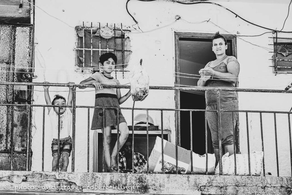 A poor family in Albania on their balcony, black and white photo