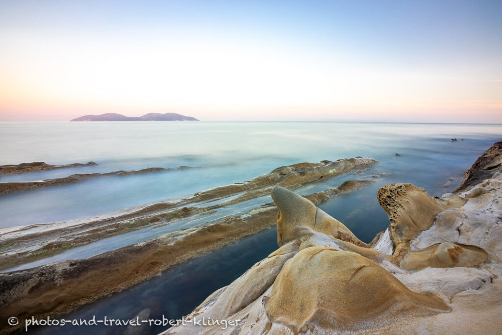 A long exposureshot of sandstone formations at the coast of Albania