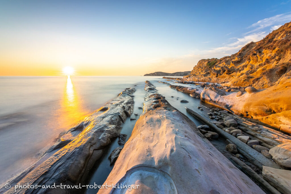 A long exposureshot of sandstone formations at the coast of Albania during sunset