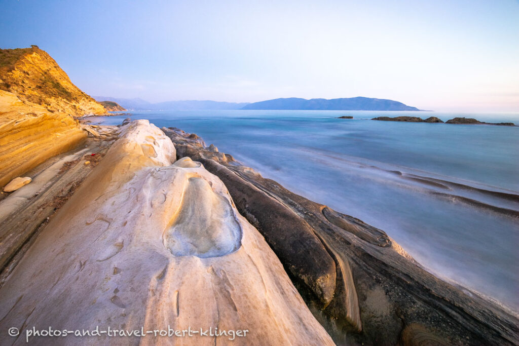 A long exposureshot of sandstone formations at the coast of Albania