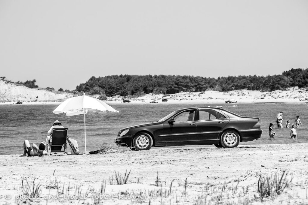 A mercedes is parked on a beach in Albania