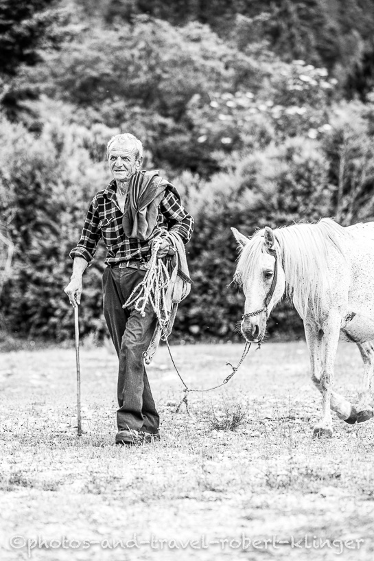 A farmer in Albnia with a horse, black and white photo