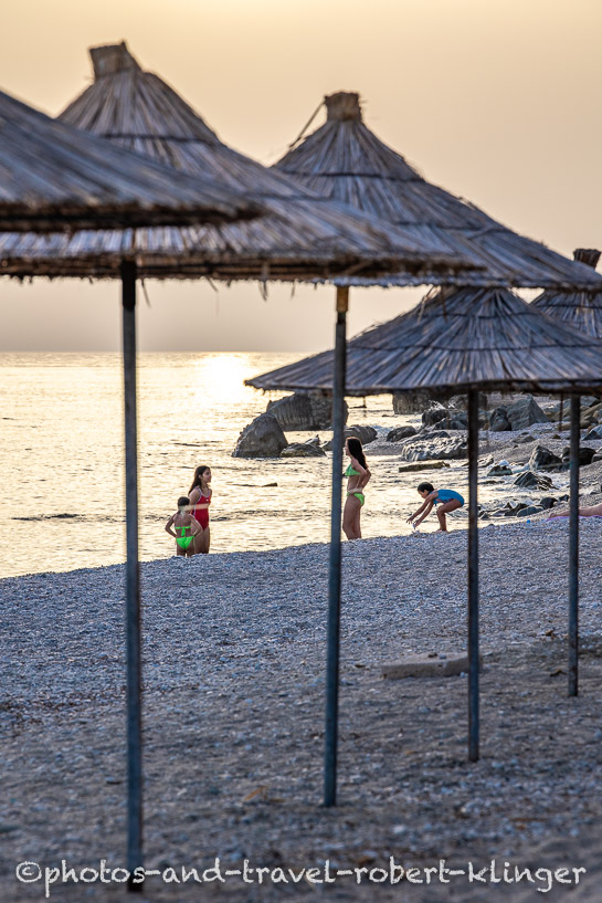 Children are playing by the beach in Albania