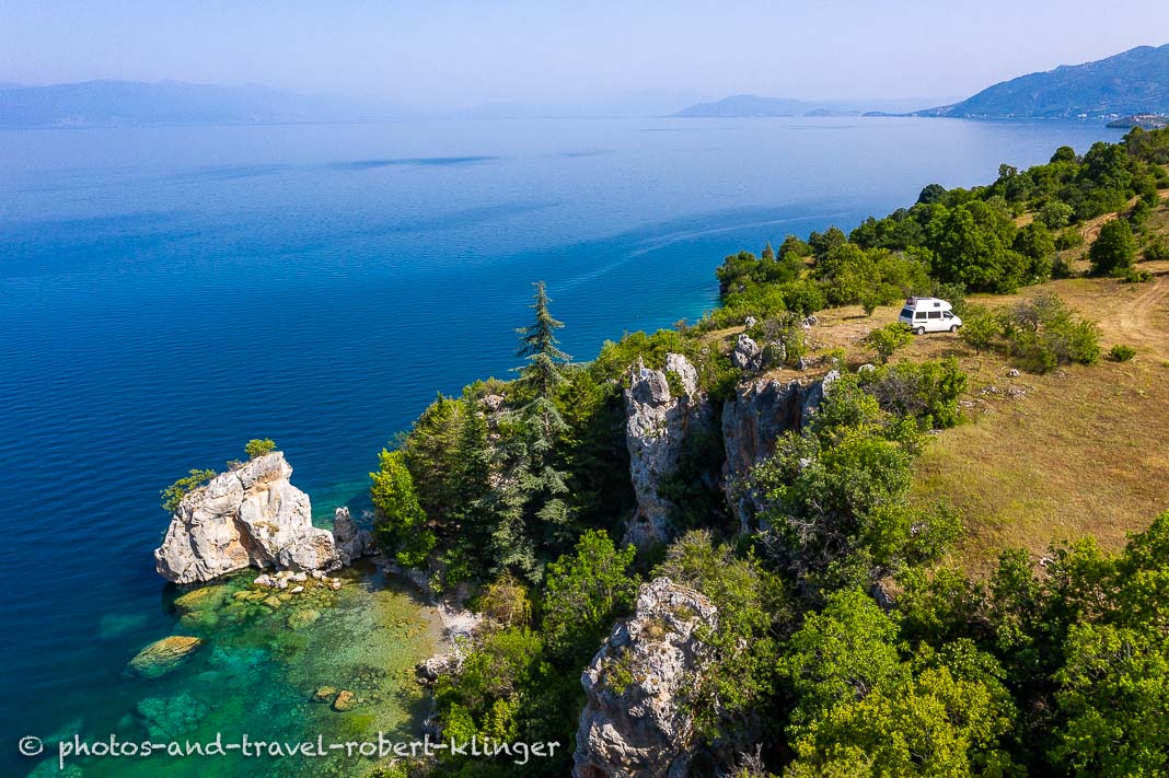 Drone photo of a VW camping van parked at lake Ohrid in Northern Macedonia