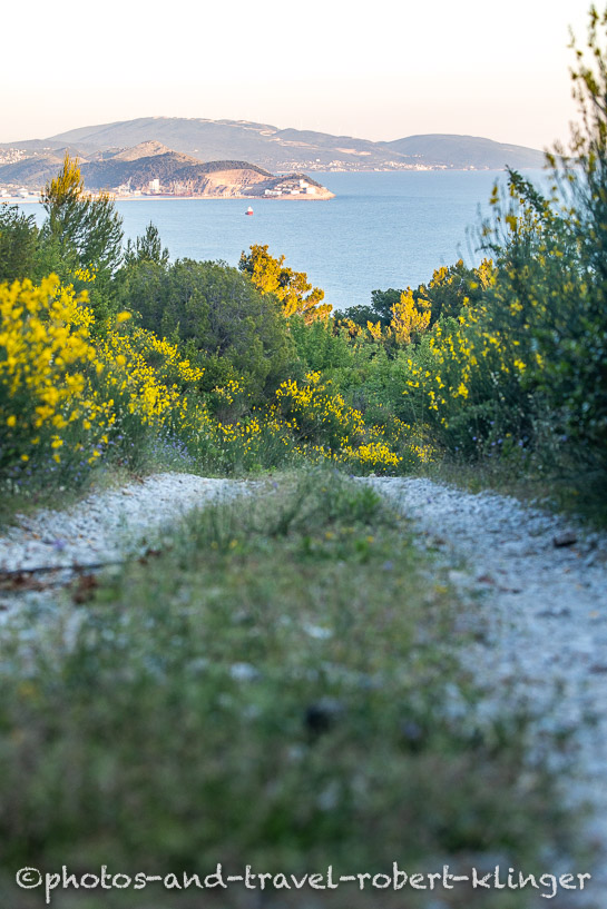 A gravel road along the coast of southern Montenegro close to the city of Bar