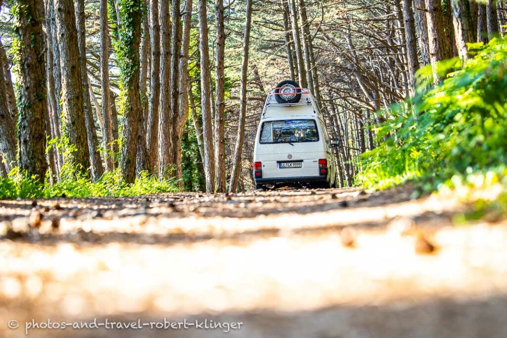 A VW T4 california syncro on a forest road in Montenegro