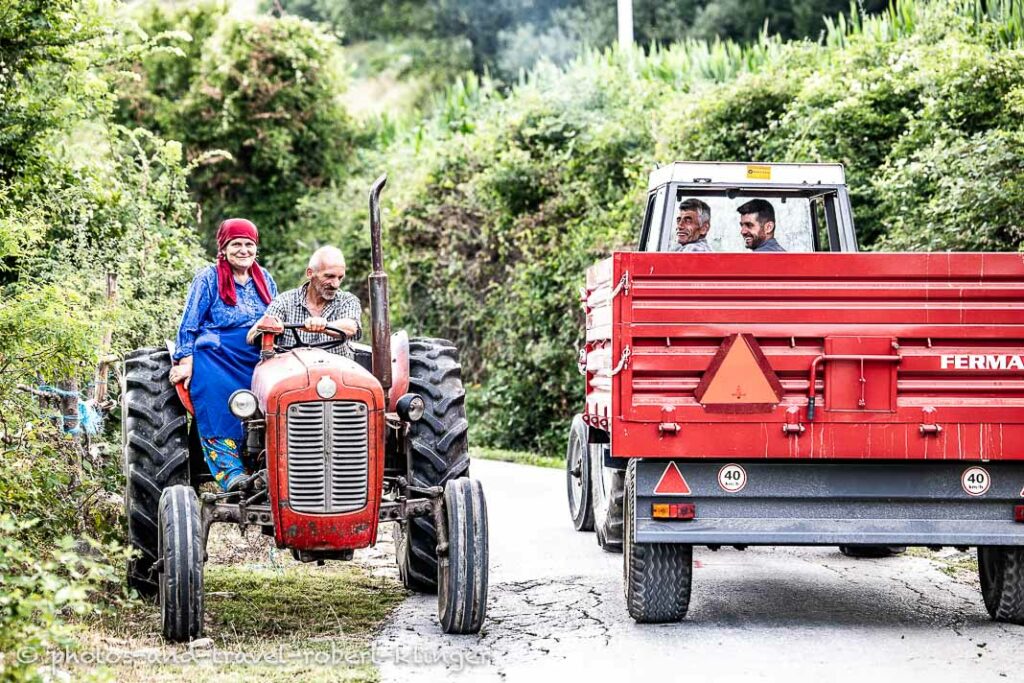 Two tractors are stopping on a narrow road in Northern Macedonia