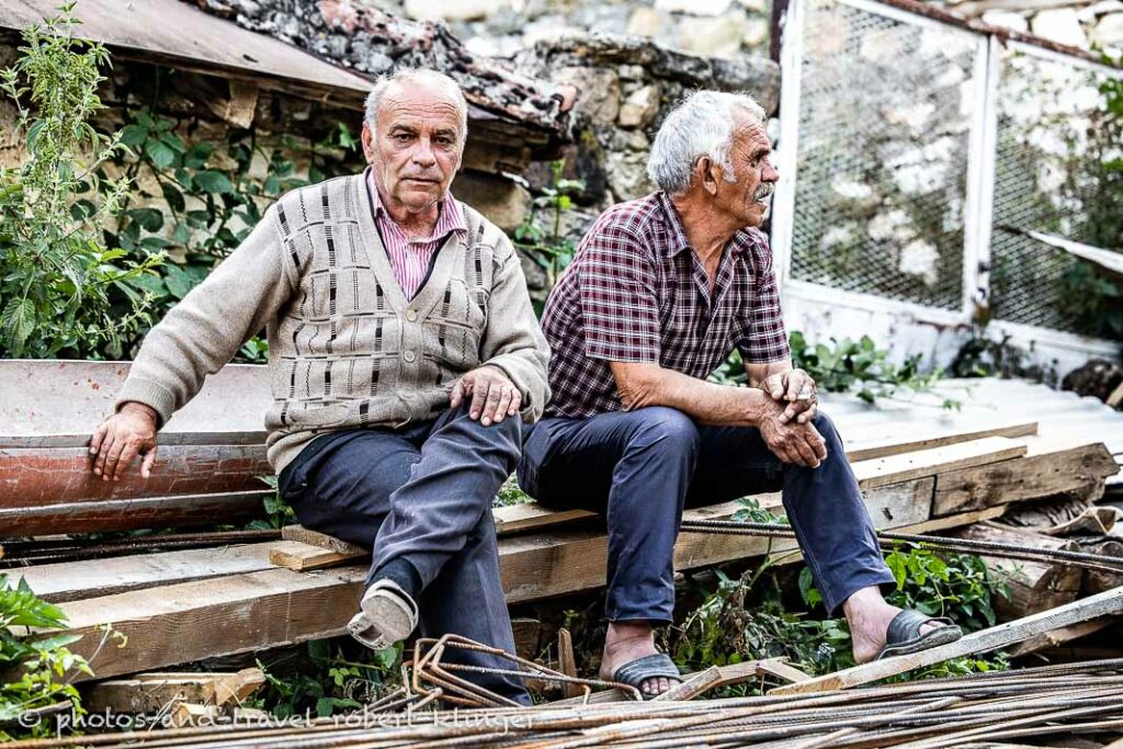 Two man sitting on a beam in Macedonia