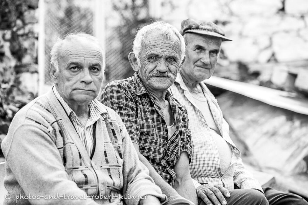 Three men of Northern Macedonia, black and white travel portrait