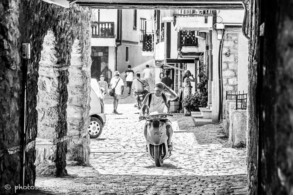 A man riding a scooter in Ohrid