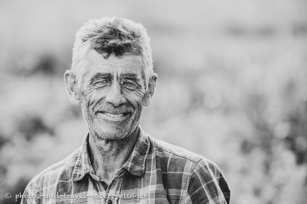 A black and white travel portrait of a man in Northern Macedonia