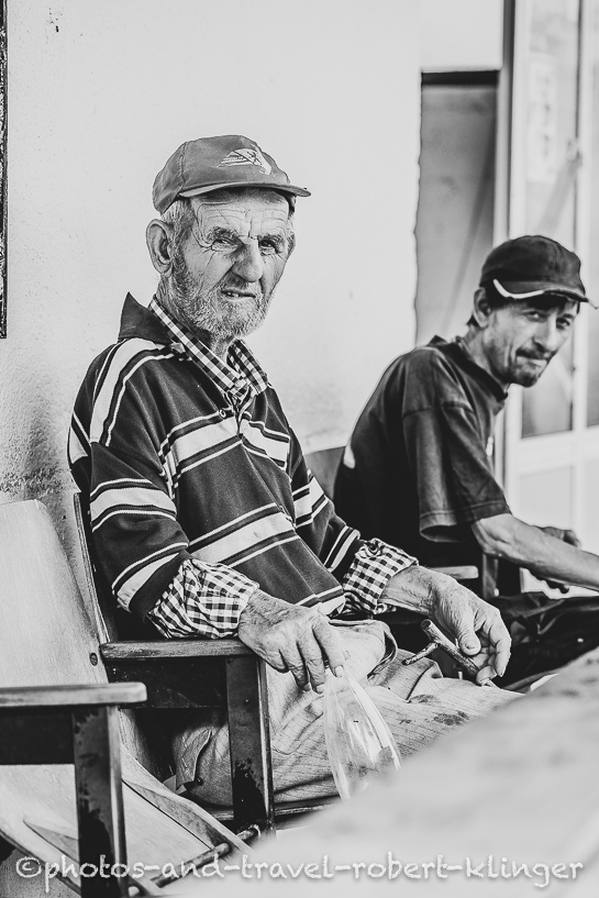 Travel portrait of two poor man in Northern Macedonia, black and white photo