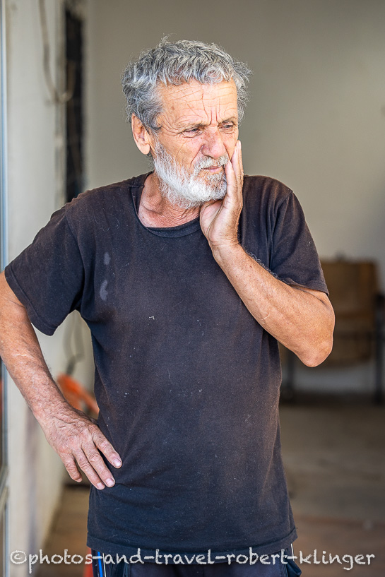 A travel portrait of an older man in Northern Macedonia