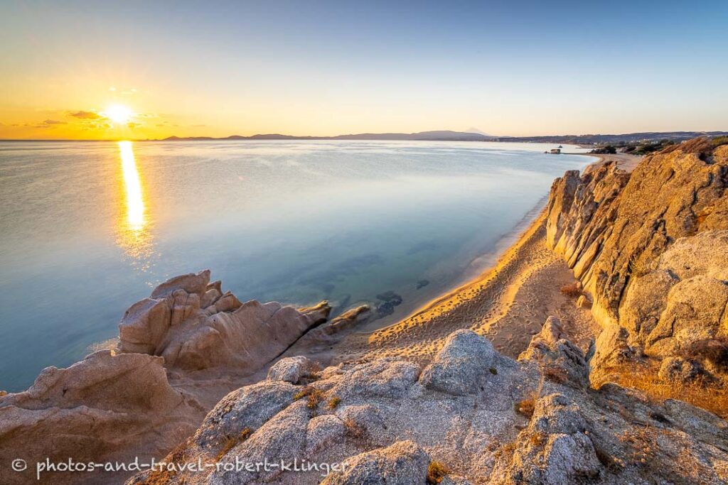 Long exposure photo of a beautiful limestone formation on a beach in Sithonia in Greece during sunrise