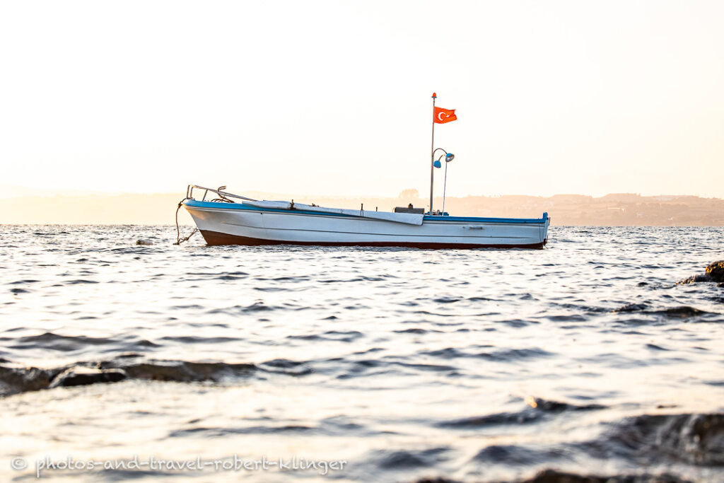 A fishing boat during sunrise in the turkish aegean sea