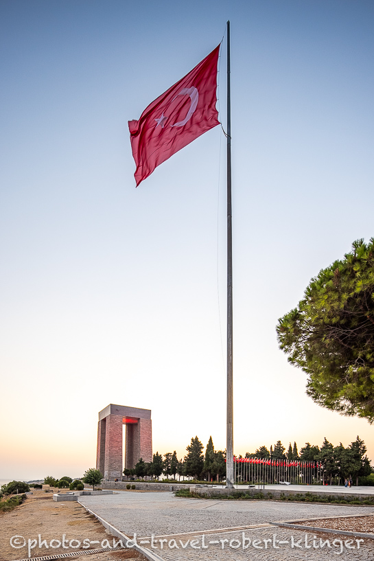 A hugeA huge turkish flag and the Çanakkale Martyrs' Memorial during sunset