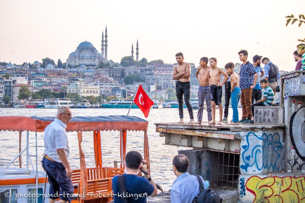 Turkish boys jumping into Golden Horn in Istanbul