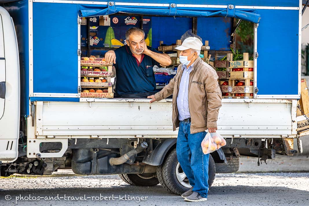 A street vendor in a turkish village selling vegetables