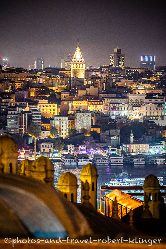 The Galata Tower seen from Süleymaniye Mosque in Istanbul during nighttime