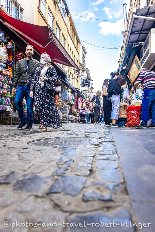 A muslim couple walking through Grand Bazar in Istanbul