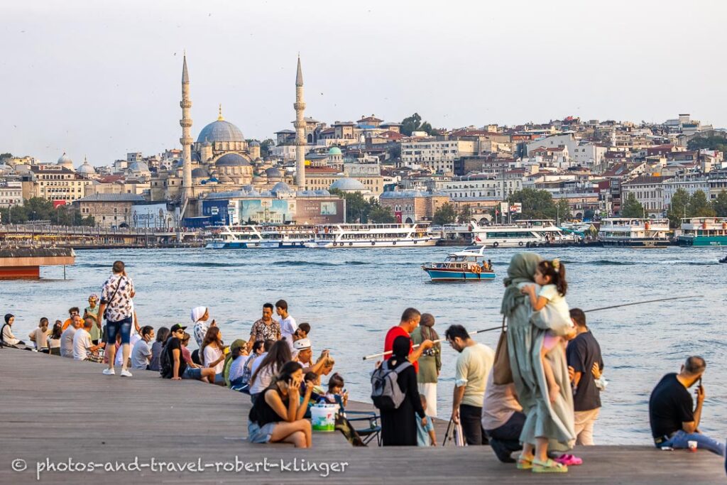 Many people at the shore of Golden Horn in Istanbul