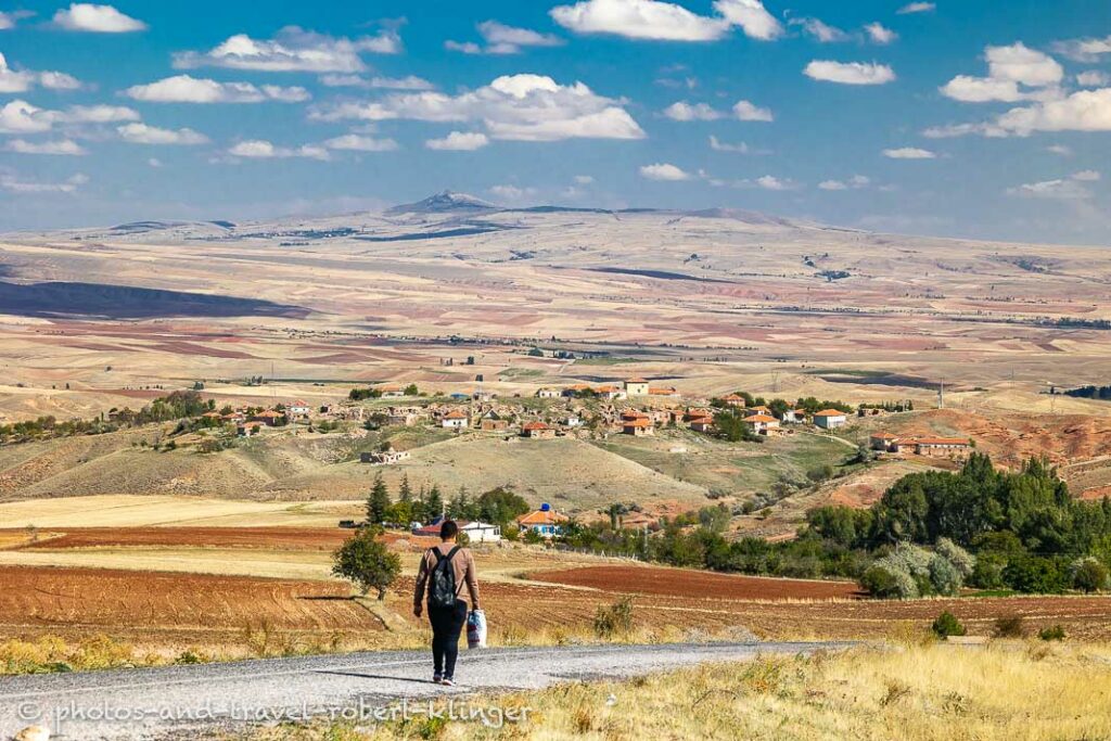 A young man walking on a road in Central Anatolia