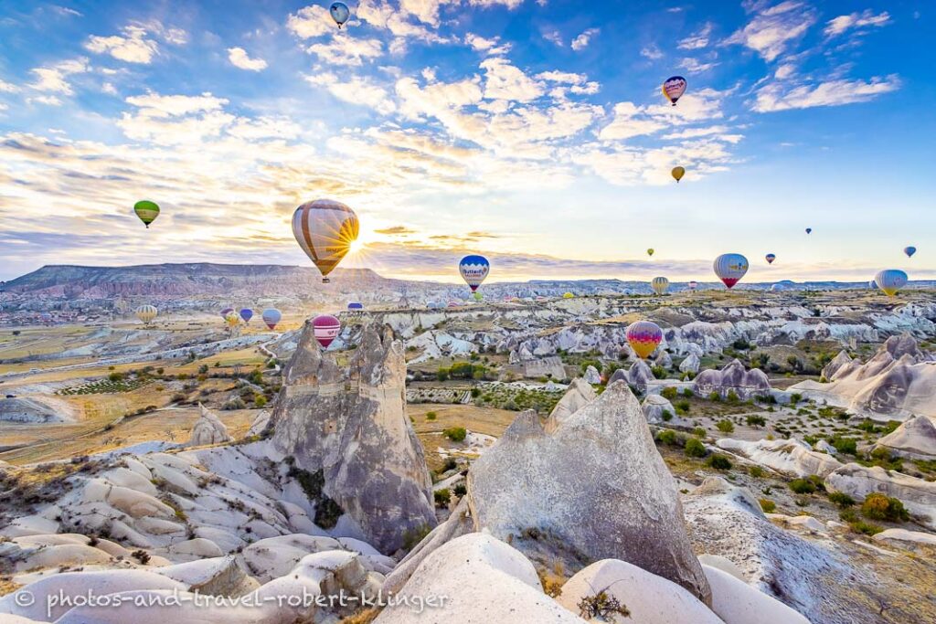 A beautiful sunrise over the love valley and the rose valley in Cappadocia