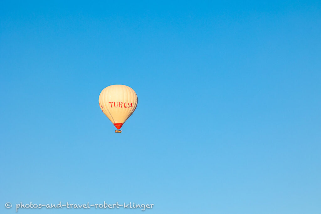 A hot air ballon high up in the sky