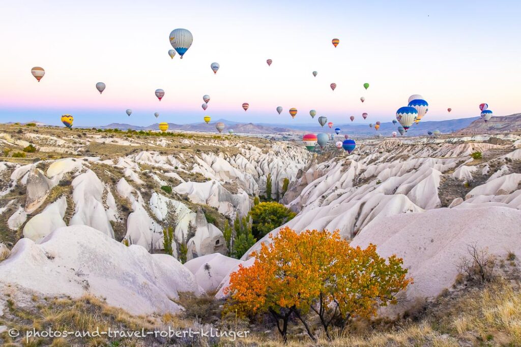 Many hot air ballons over Cappadocia on an early morning